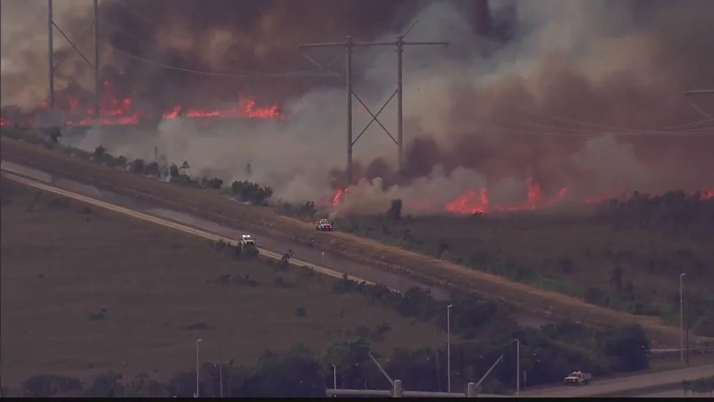 Officials continue to fight wildfires burning in west Miami-Dade