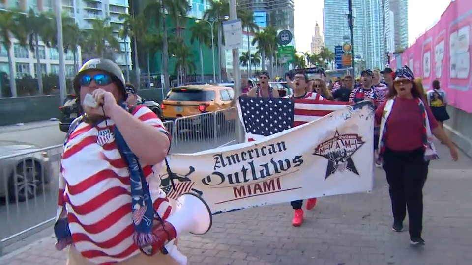 American Outlaws Miami members march to Fan Fest to cheer on Team USA in match against Turkey