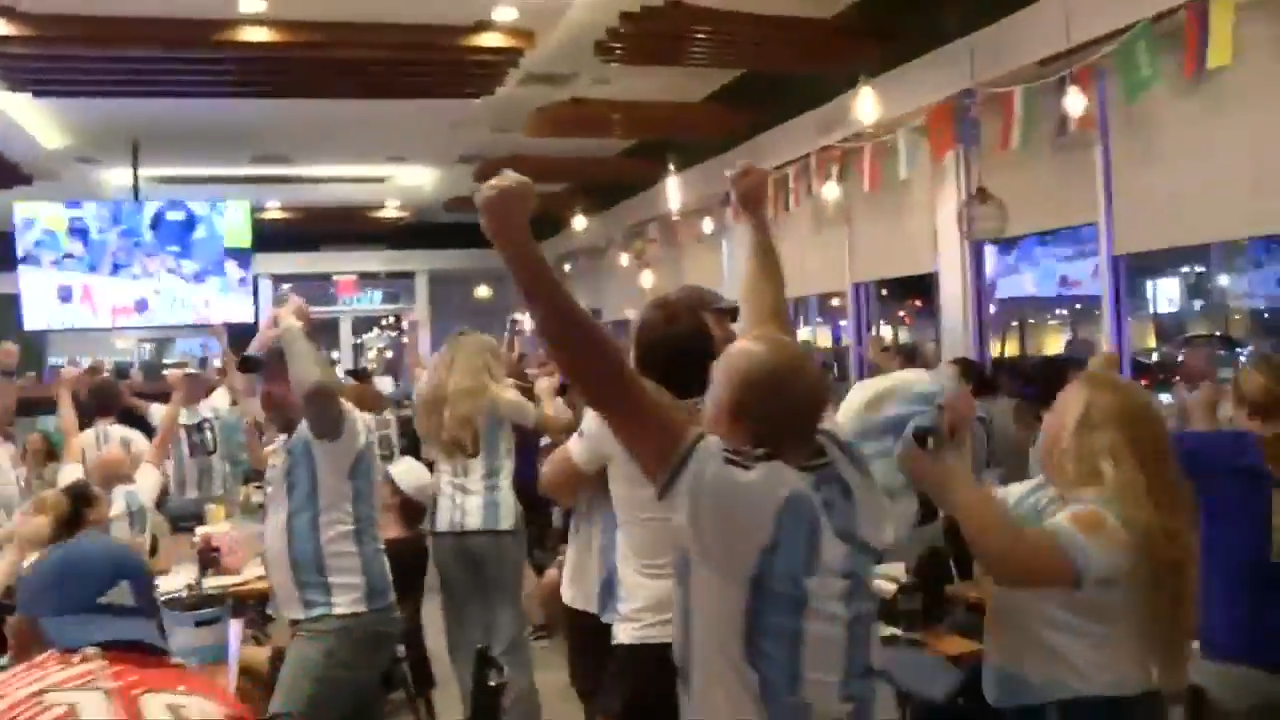 Argentina fans at Manolo in Miami Beach celebrate 3-1 World Cup victory against Switzerland, as Argentina moves to semifinals